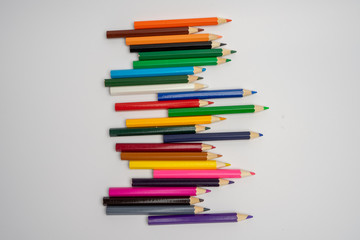 A variety of colored pencils disordered
