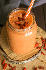 Orange smoothie with goji berries. Healthy eating