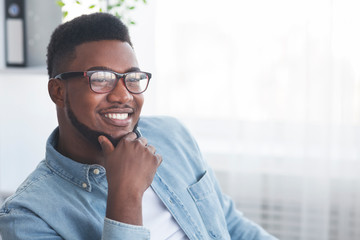 Portrait of handsome smiling african american man in glasses