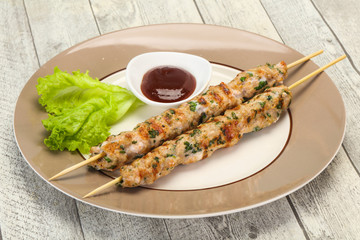 Minced pork skewer kebab with sauce