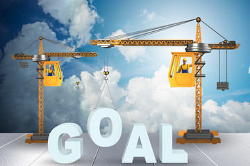 Crane lifting the word goal up