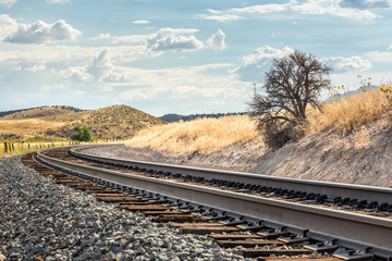 Curved railraod track in scenic landscape of Utah