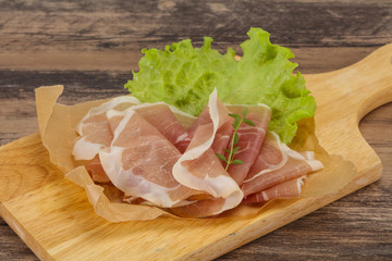 Italian prosciutto pork meat over board