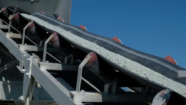 Conveyor belt transporting stone and gravel to the manufacturing plant