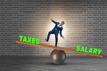 Businessman balancing between taxes and salary