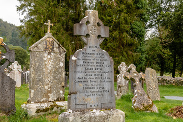 Fototapeta premium Monastery cemetery of Glendalough, Ireland. Famous ancient monastery in the wicklow mountains with a beautiful graveyard from 11th century