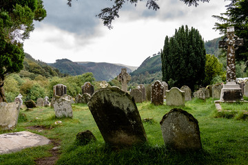Monastery cemetery of Glendalough, Ireland. Famous ancient monastery in the wicklow mountains with...