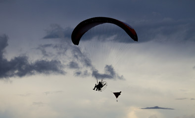 silhoutte paraglider in action