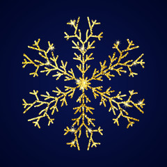 Gold glitter snowflake on dark blue background