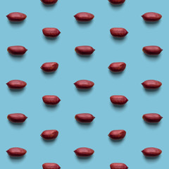 Fresh healthy tasty nutritious peanuts on light blue background. Top view. Flat layout. Seamless pattern