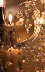 Blurred Background Chrystal chandelier lamp on the ceiling in Dining room Adjusting the image in a Luxury tone . Decorative elegant vintage and Contemporary interior Concept.