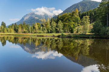 Oberstdorf - View to Lake Moorweiher with Nebelhorn mountain reflected on the water / Bavaria / Germany