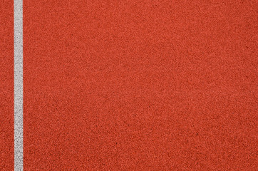 Top view of the running track rubber lanes cover texture with white line marking for background.
