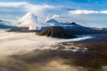 A sea of clouds surrounding Mount Bromo at sunrise, East Java, Indonesia.