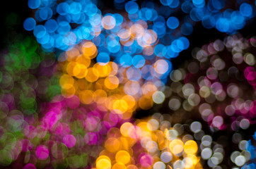 Abstract colorful soft blurred bokeh on black background. Shining and blurred circles lights bokeh background. For used wallpaper texture and background.