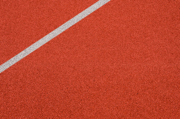 Top view of the running track rubber lanes cover texture with white line marking for background.