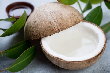 Coconut water in a natural coconut, selective focus, close-up, studio shot