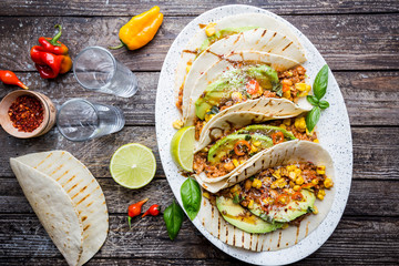Mexican tacos with meat, beans corn and salsa. Top view