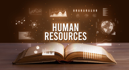 HUMAN RESOURCES inscription coming out from an open book, creative business concept