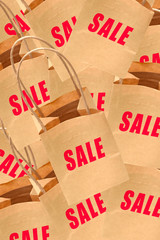 Paper bags with sale text to promote store sales and shopping