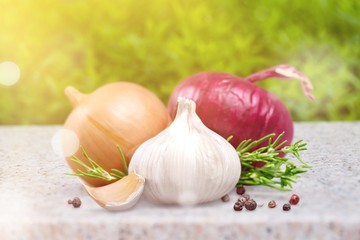 Garlic and onion with peppercorn and parsley isolated on white background