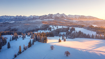 Winter nature aerial view. Sunrise in Tatra mountains, Poland. Beautiful mountain nature in morning sunlight