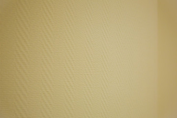 Textured beige textile wallpaper surface for home or office decor