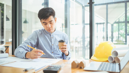 Architect or engineer working in office