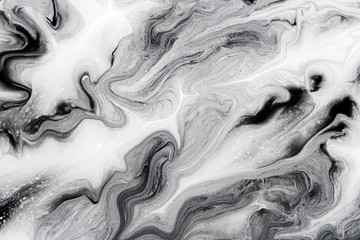 Fototapety  marble texture formed by mixing the black and white acrylic paint, abstract background