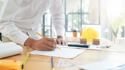 Architect or engineer working in office