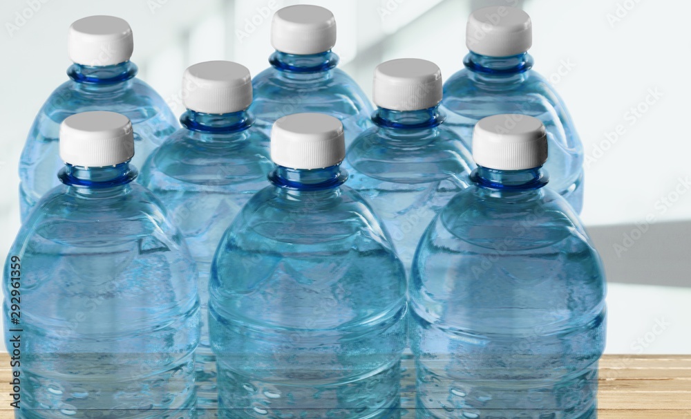 Poster Plastic bottles of water isolated on background