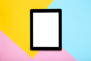 Tablet computer on colorful background