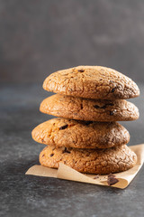 Fototapeta na wymiar Chocolate cookies on grey table. Chocolate chip cookies shot. Homemade food on grey background.