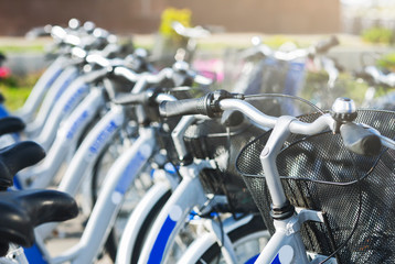 Row of similar bicycles for sharing outdoor, free space