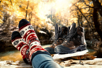 Wool socks with autumn shoes and forest with golden leaves 