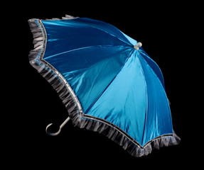 blue  umbrella on black background