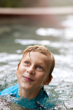 Close up of smiling boy in swimming pool