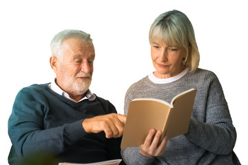 Senior couple  reading book in living room