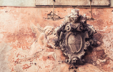 Architectural detail of cartouche angel fresco. - obrazy, fototapety, plakaty