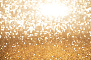 golden yellow glittering Christmas lights. Blurred abstract background