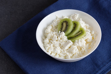 Organic dieting cottage cheese with kiwi.