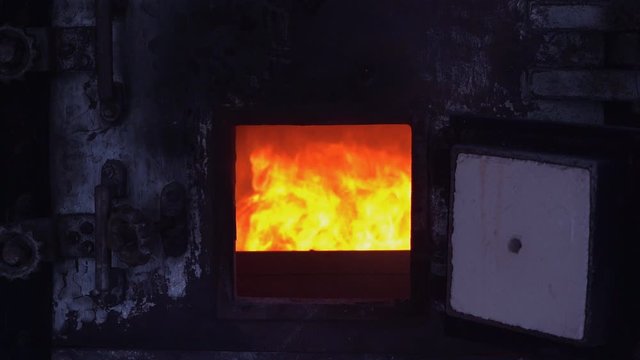 Slow motion fire flame cremate death people burning on dark background.