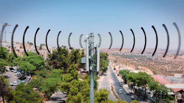 Aerial footage of Celular antenna Emitting Radiation and radio waves Visualization of radio waves coming from a Celular antenna Populated  neighborhood emitting radio signals, drone