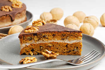 Homemade Carrot Cake with Walnuts and Chocolate Icing. Shallow focus.