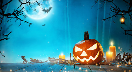 Spooky halloween pumpkin in forest