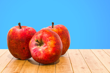 Red Apples close-up 3d rendering with realistic texture on the wooden table