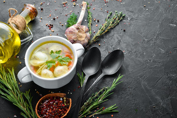 Soup with meat balls and quail eggs. Dishes, food. Top view. Free space for your text.