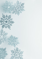 Festive winter background with decorative snowflakes in flying. Christmas, Winter or New Year...