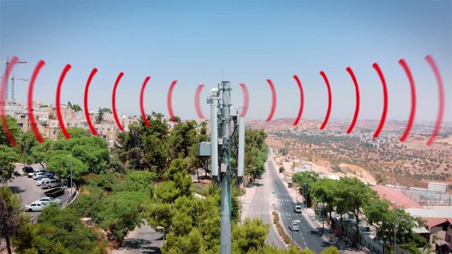 Aerial footage of Celular antenna Emitting Radiation and radio waves Visualization of radio waves coming from a Celular antenna Populated  neighborhood emitting radio signals, drone