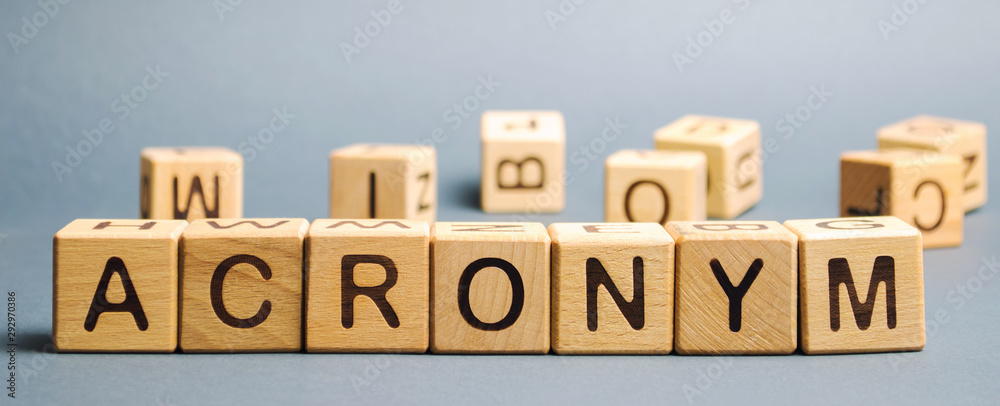 Fototapete wooden blocks with the word acronym. abbreviation from the initial components of a phrase or a word.